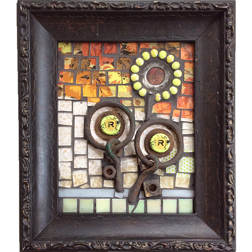 mosaic with glass tiles and reporposed metal in a black frame