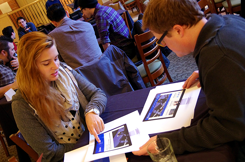 Designer review a student's portfolio