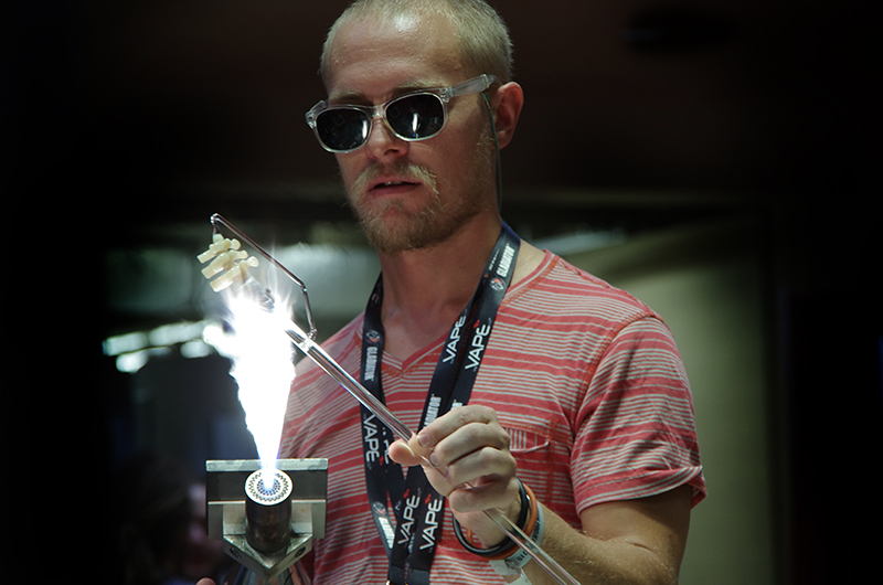 Man working glass with a flame