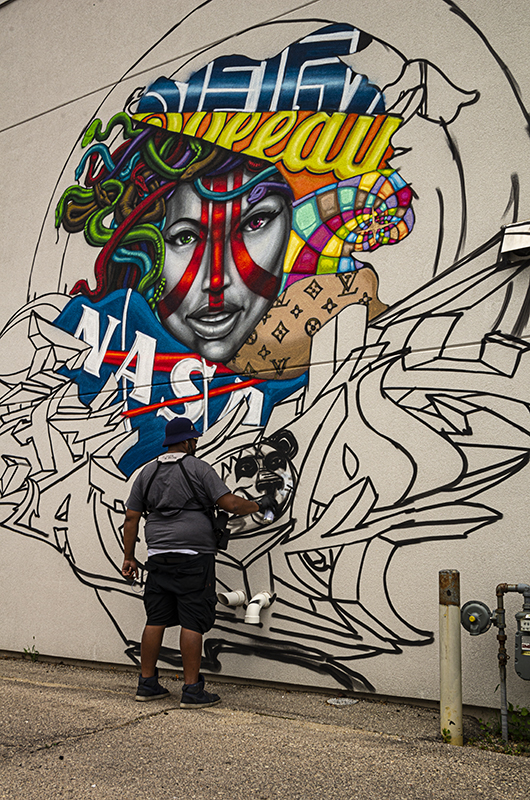 Man painting a wall.