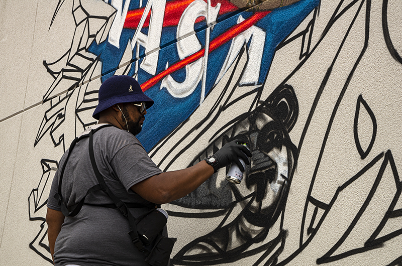 Man painting a wall.